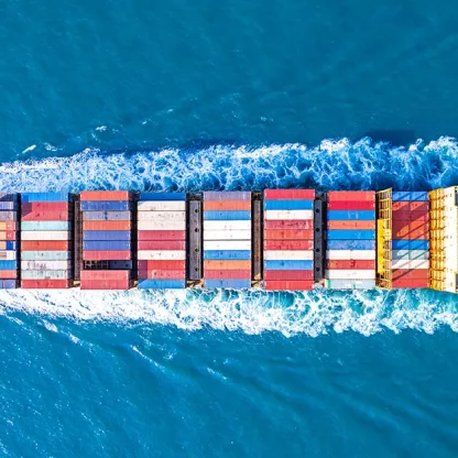 photograph of shipping container in the sea from above